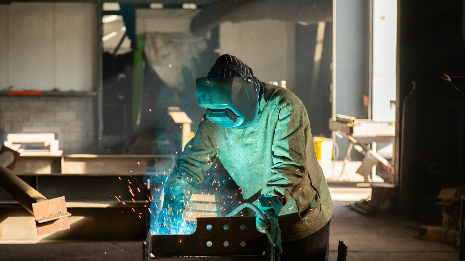 a welder working on a piece of metal